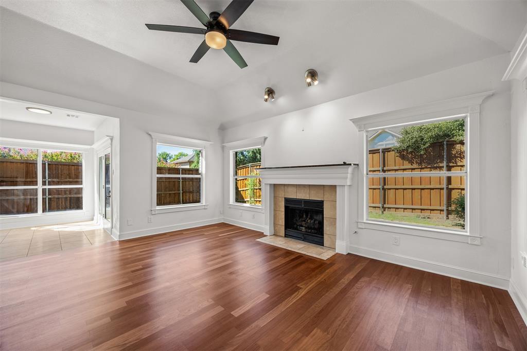 Beautiful solid Brazilian Cherry Wood, 3/4" x 3 1/4" installed over vapor barrier and 3/4" plywood.  Gas Fireplace, Ceiling Fan, double insulated low E glass installed.  Custom baseboards and window trim have been installed.