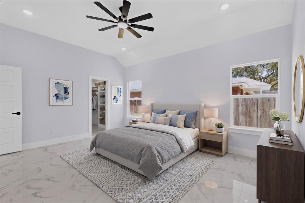 Vaulted ceiling with an installed ceiling fan, recessed lighting, expansive windows, and durable tile flooring