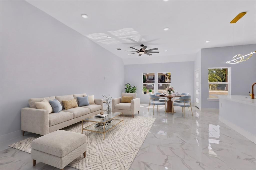 Recessed lighting throughout, wood-finish ceiling fan, and large windows