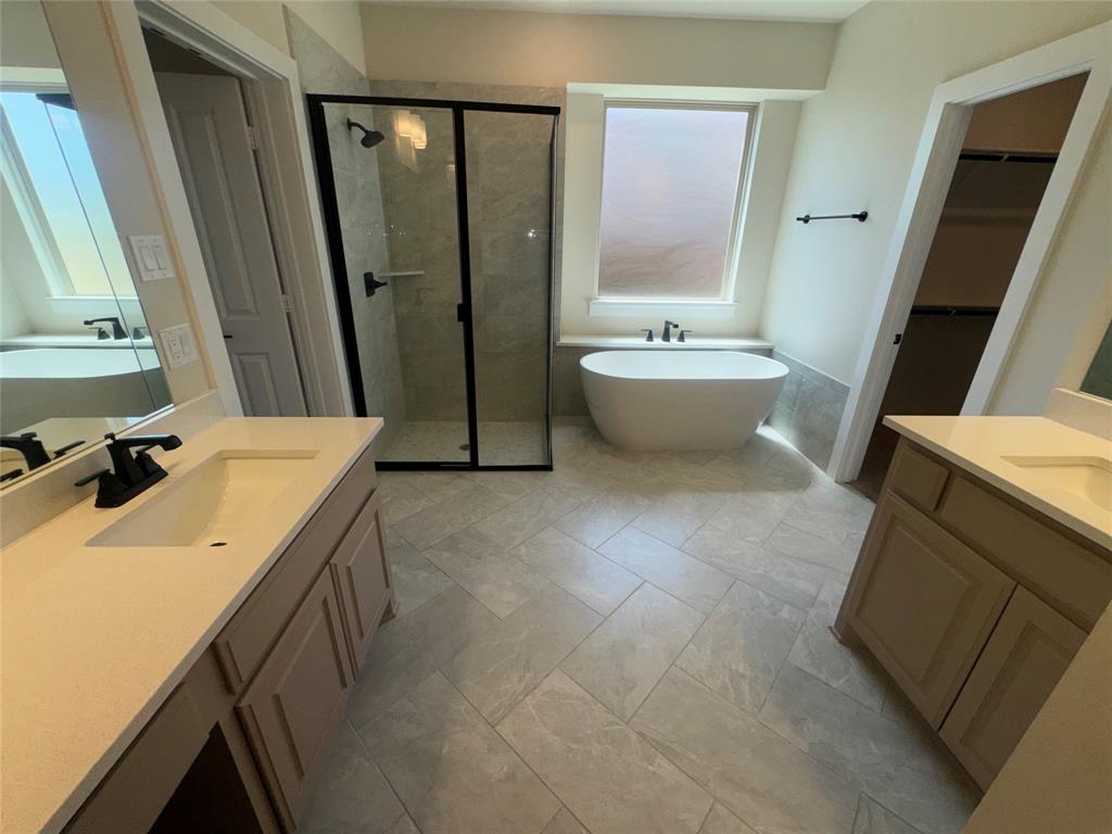 Dual vanities with integrated sinks and matte black fixtures Dual vanities with integrated sinks and matte black fixtures
