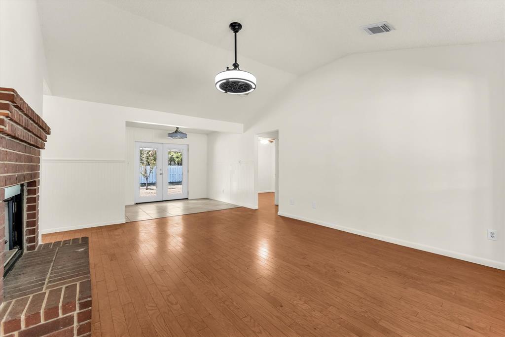 Vaulted ceilings complemented by a ceiling fan with integrated lighting