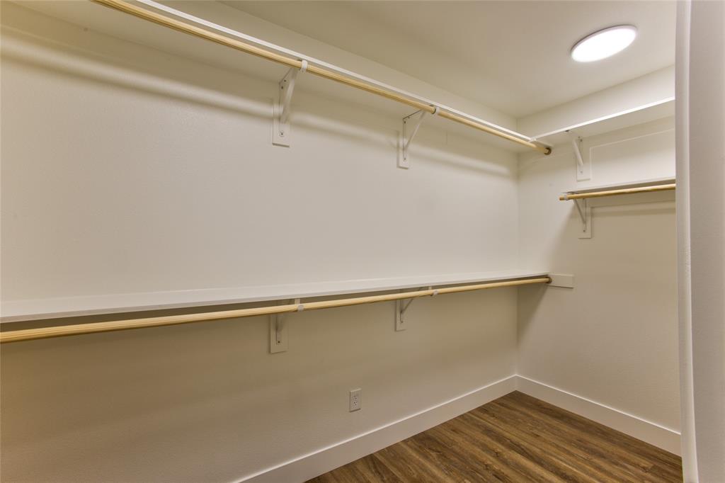 View Into Spacious Primary Suite Closet