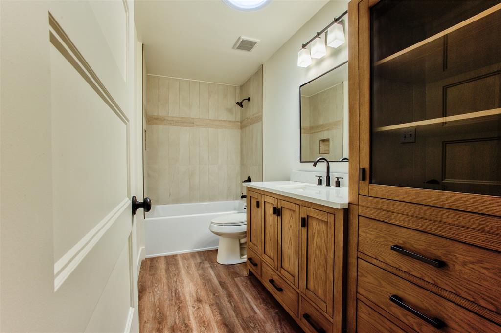 All New Cabs, Vanity, Counters, Sink, Tub wCeramic Tile Enclossure & Fixtures, LVP wContemporary Lighting