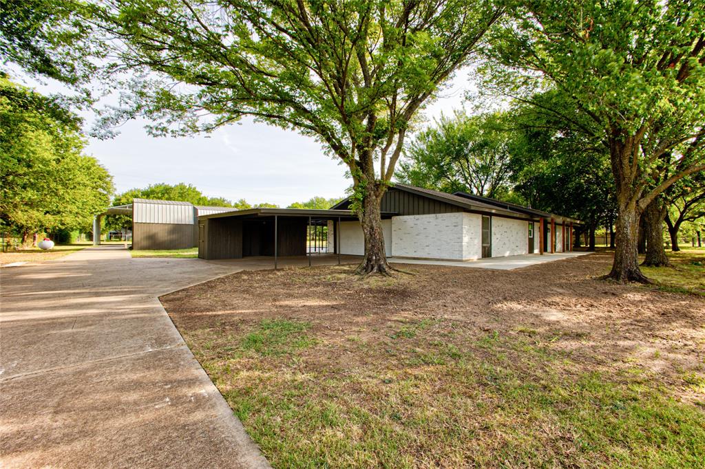 A More Narrowed View Approaching up the Concrete Driveway