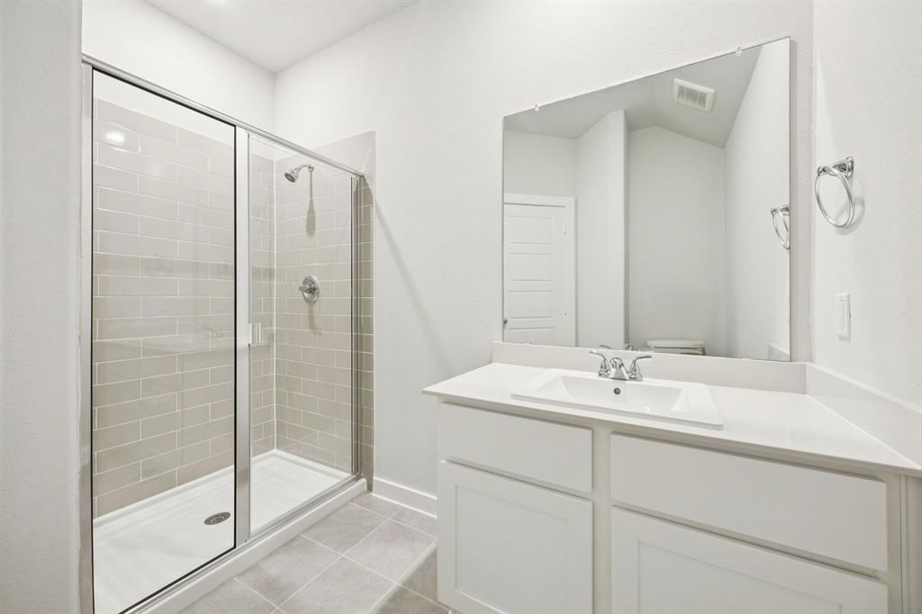 Bathroom in the Masters home plan by Trophy Signature Homes – REPRESENTATIVE PHOTO