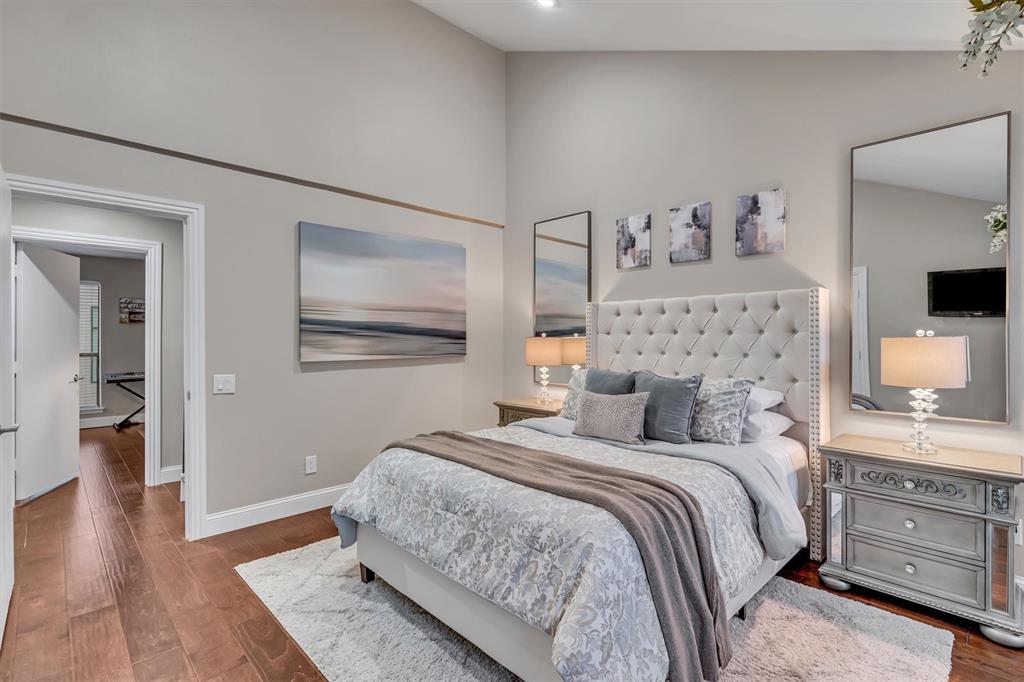 Primary bedroom. Hardwood-style flooring throughout