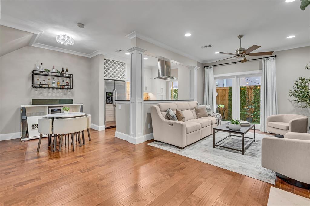 Wood-finish flooring throughout, recessed lighting, and a ceiling fan