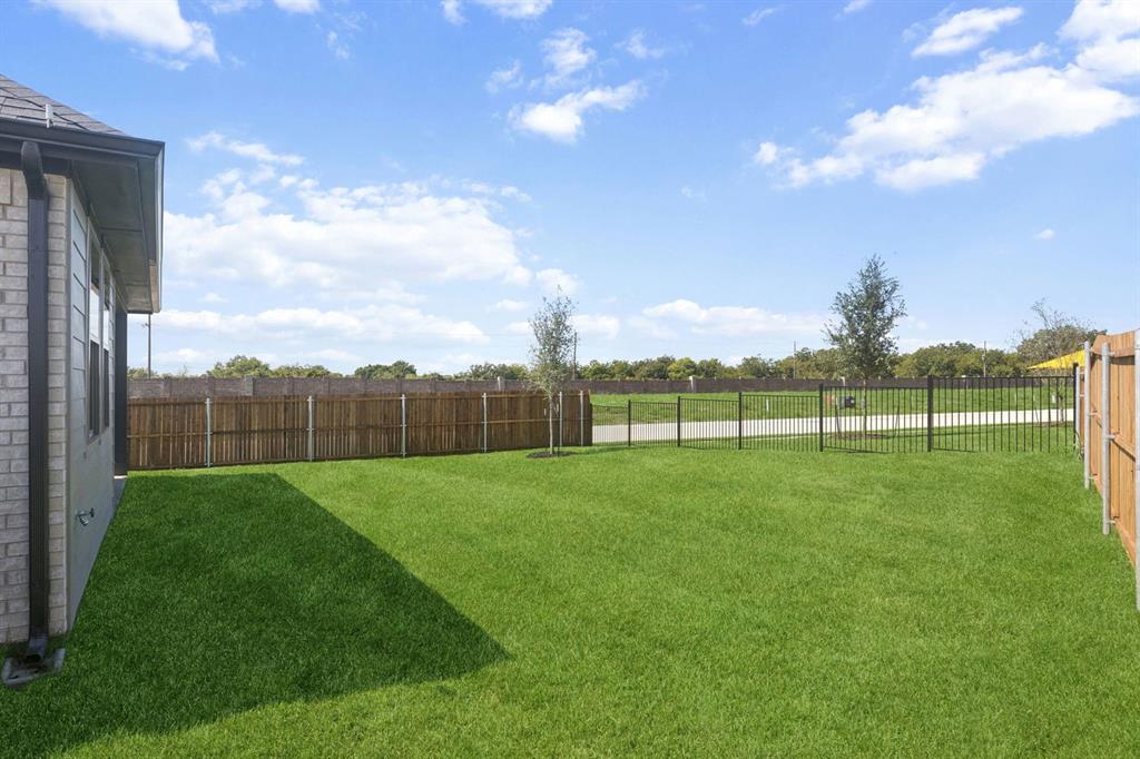 Backyard in the Magnolia home plan by Trophy Signature Homes – REPRESENTATIVE PHOTO
