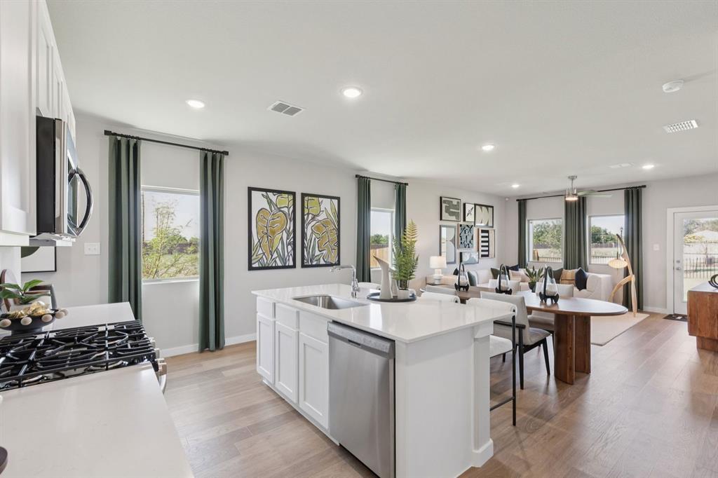 Kitchen in the Magnolia home plan by Trophy Signature Homes – REPRESENTATIVE PHOTO Kitchen in the Magnolia home plan by Trophy Signature Homes – REPRESENTATIVE PHOTO