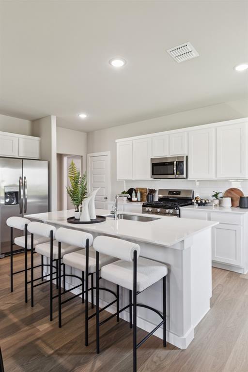 Kitchen in the Magnolia home plan by Trophy Signature Homes – REPRESENTATIVE PHOTO Kitchen in the Magnolia home plan by Trophy Signature Homes – REPRESENTATIVE PHOTO