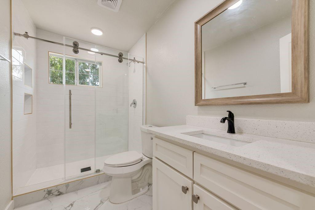 Vanity with composite stone countertop and integrated sink