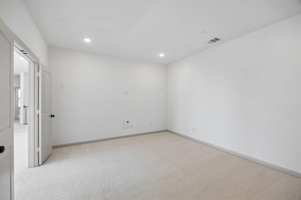 This spacious media room with adjoining game room creates the ultimate family entertainment zone!