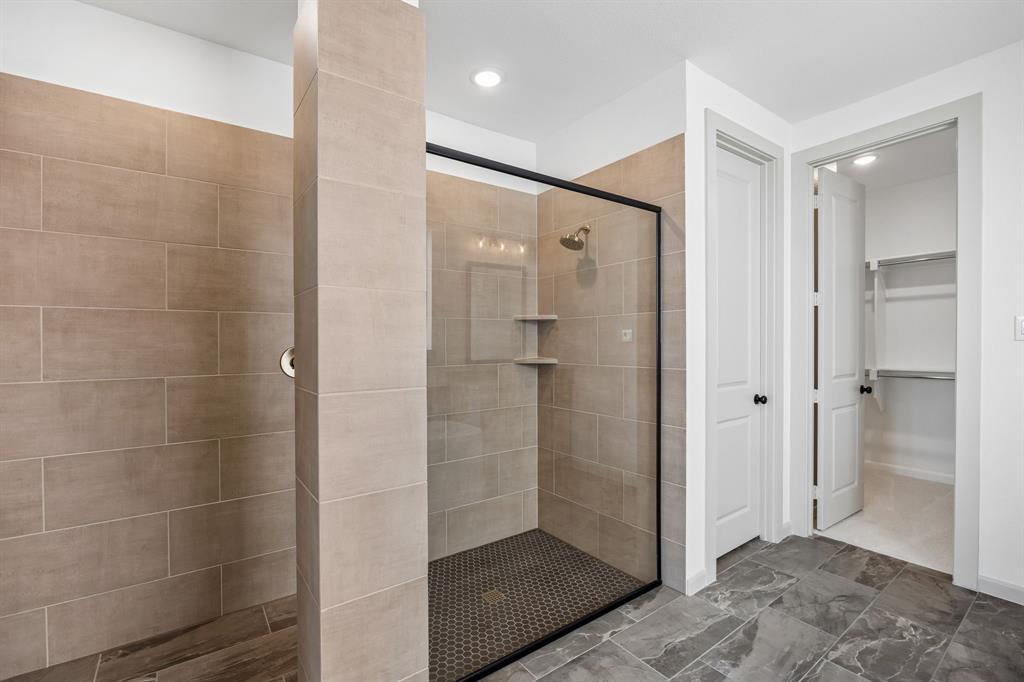Featuring a spacious walk in shower with drying area and outstanding owner's closet, this dream bath is waiting for you to call it your own!