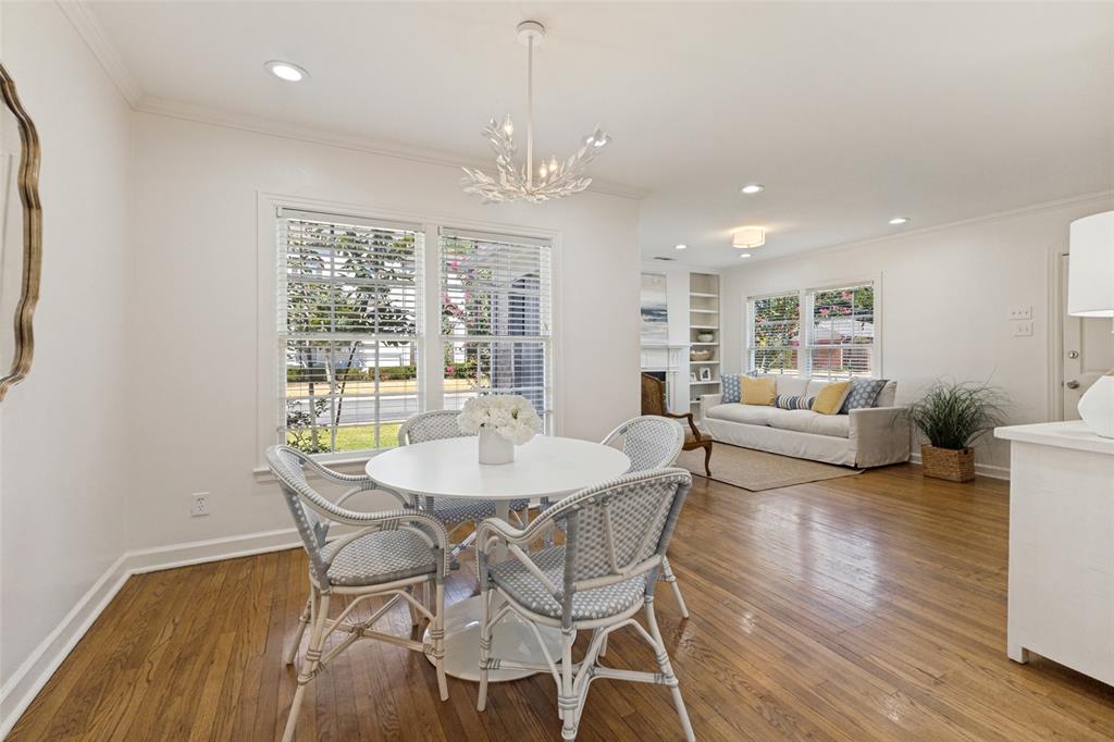 The open dining room provides space for larger gatherings if one desires. Shown with a buffet to the right.