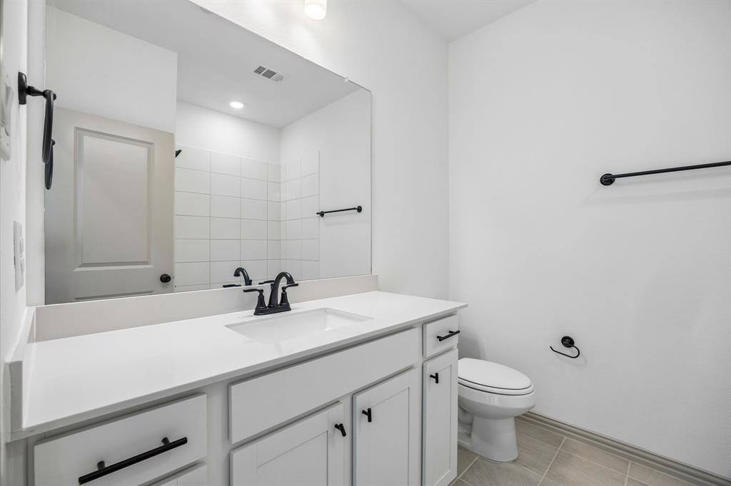 Guests will feel right at home in this beautifully finished guest bath.