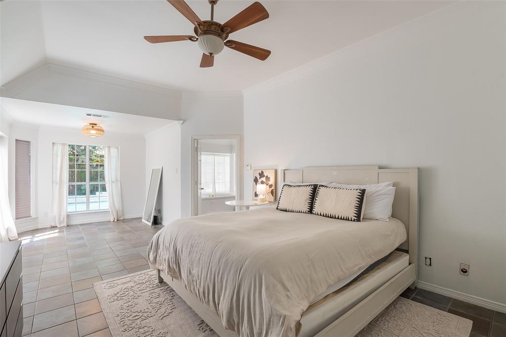 Vaulted ceilings, large bay windows, recessed lighting, ceiling fan, and tile flooring