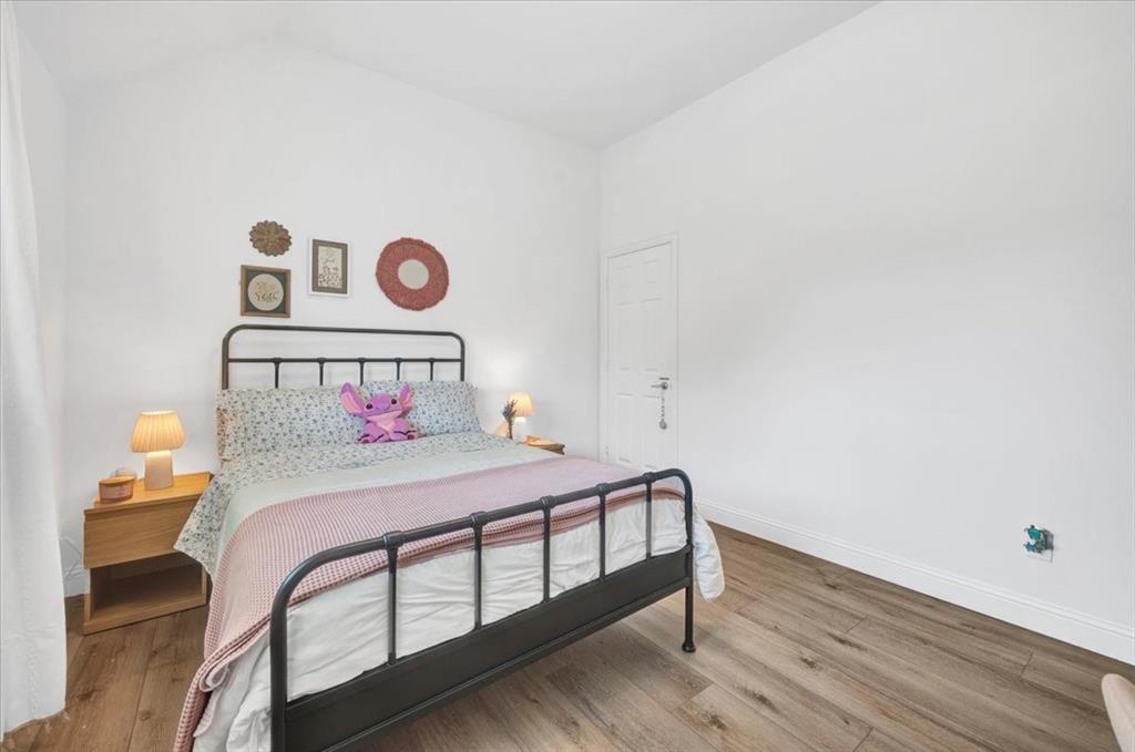 Vaulted ceiling with wood-finish flooring