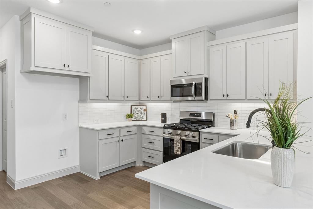 The kitchen peninsula does double duty as the perfect place for a quick family meal or homework station! The kitchen peninsula does double duty as the perfect place for a quick family meal or homework station!