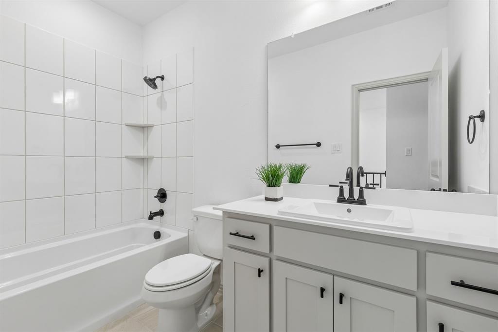Friends and family will feel right at home in the lovely guest bath in our Conley plan.