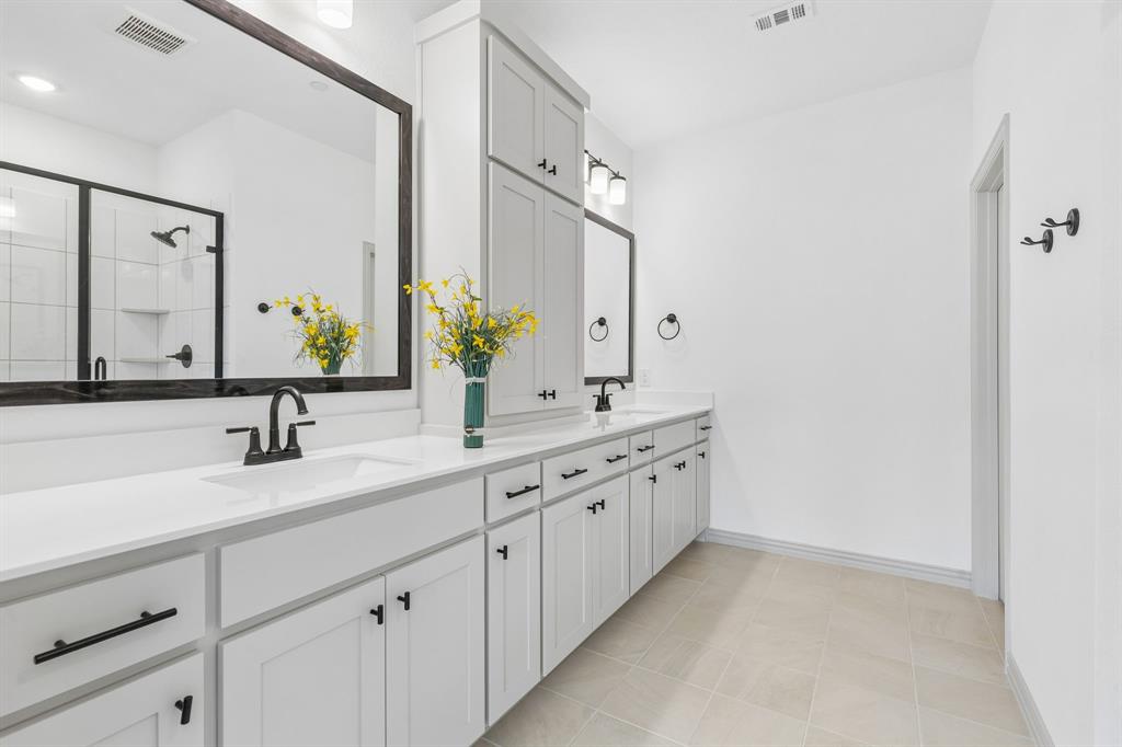 With ample room for two and a spacious walk in shower, there is no shortage of space or style in this wonderful owner's bath!
