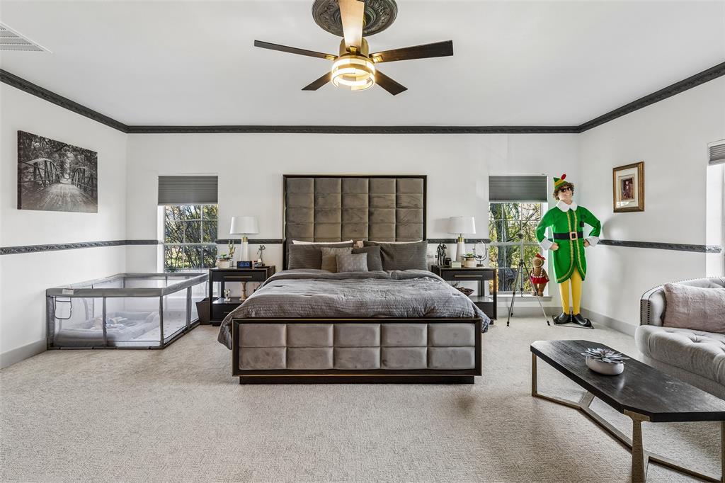 Recessed lighting, ceiling fan with ornate medallion, crown molding, double windows, and carpet flooring