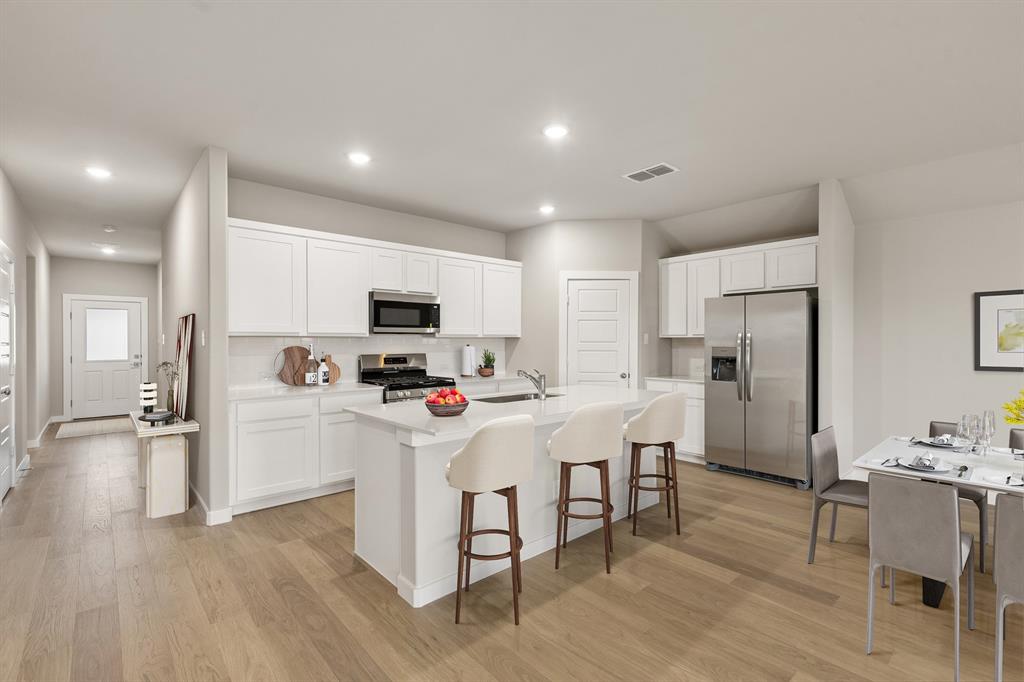 Kitchen in the Emmy II home plan by Trophy Signature Homes - REPRESENTATIVE PHOTO Kitchen in the Emmy II home plan by Trophy Signature Homes - REPRESENTATIVE PHOTO