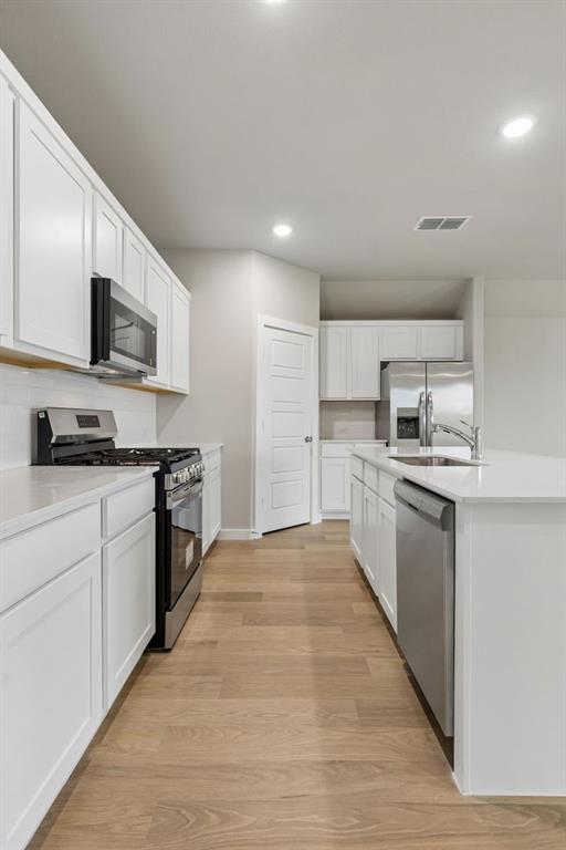 Kitchen in the Emmy II home plan by Trophy Signature Homes - REPRESENTATIVE PHOTO Kitchen in the Emmy II home plan by Trophy Signature Homes - REPRESENTATIVE PHOTO