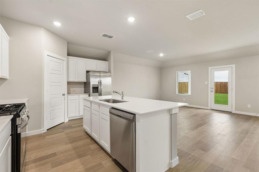 Kitchen in the Emmy II home plan by Trophy Signature Homes - REPRESENTATIVE PHOTO Kitchen in the Emmy II home plan by Trophy Signature Homes - REPRESENTATIVE PHOTO