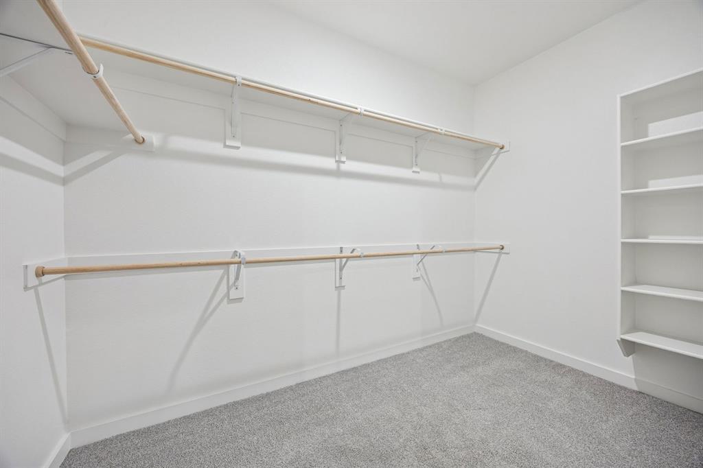 Primary Closet in the Oak II home plan by Trophy Signature Homes – REPRESENTATIVE PHOTO