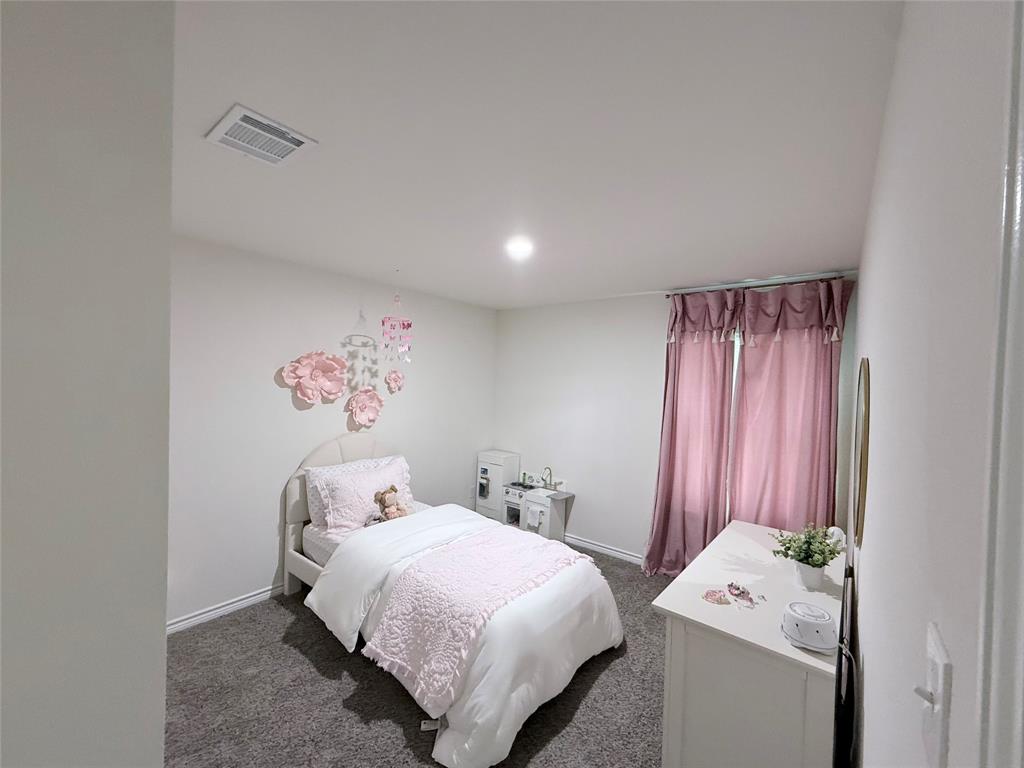 Recessed lighting, light gray wall paint, gray carpet flooring, and window treatments Recessed lighting, light gray wall paint, gray carpet flooring, and window treatments