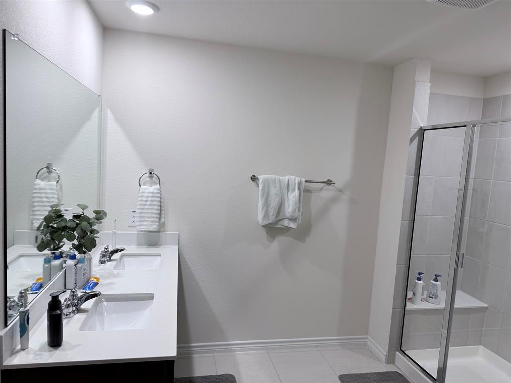 Dual vanity with integrated sinks and chrome fixtures Dual vanity with integrated sinks and chrome fixtures
