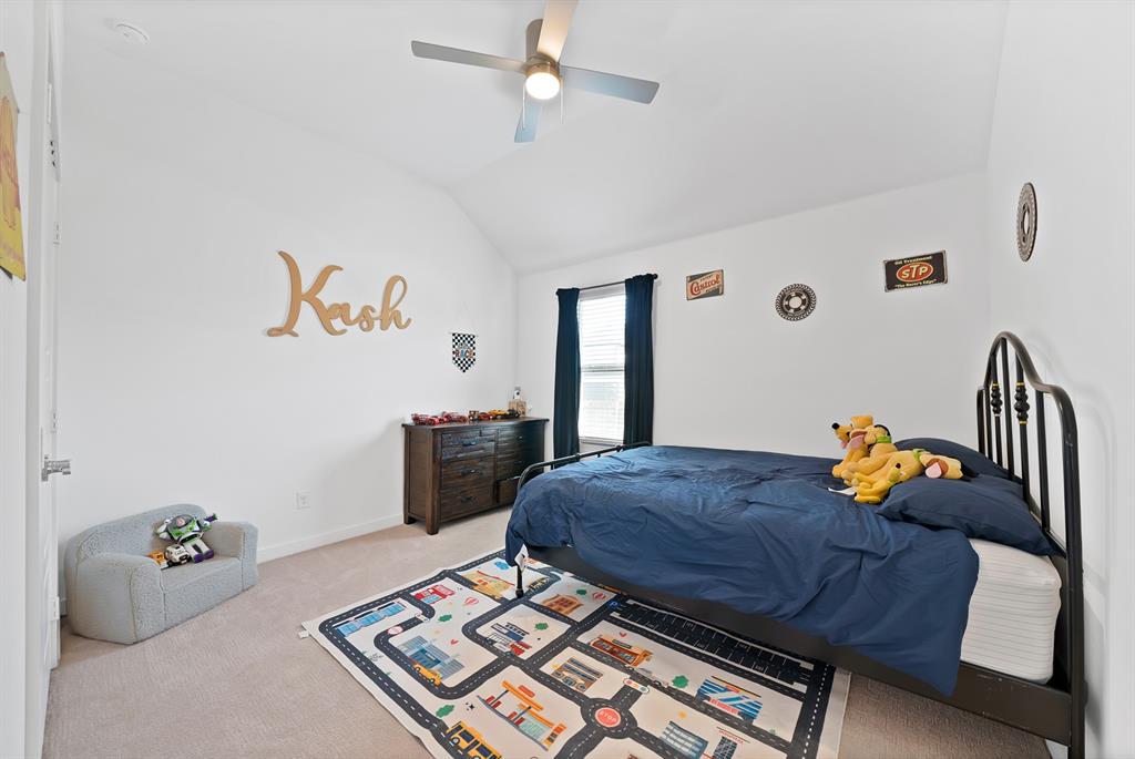 #3 - Another secondary bedroom with carpet and a ceiling fan.