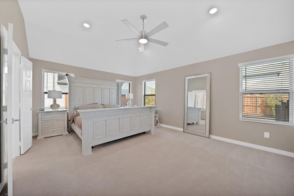 Primary bedroom with enough space for a home office or sitting area.