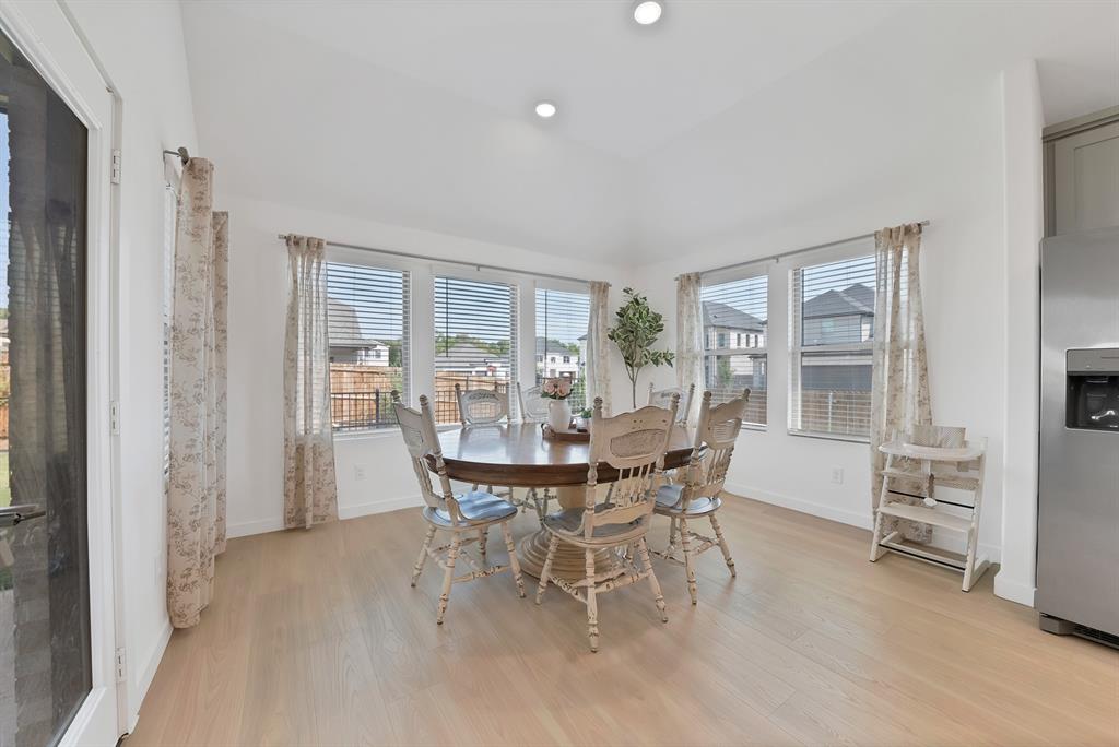 Separate dining room with windows that flood the home with natural light.