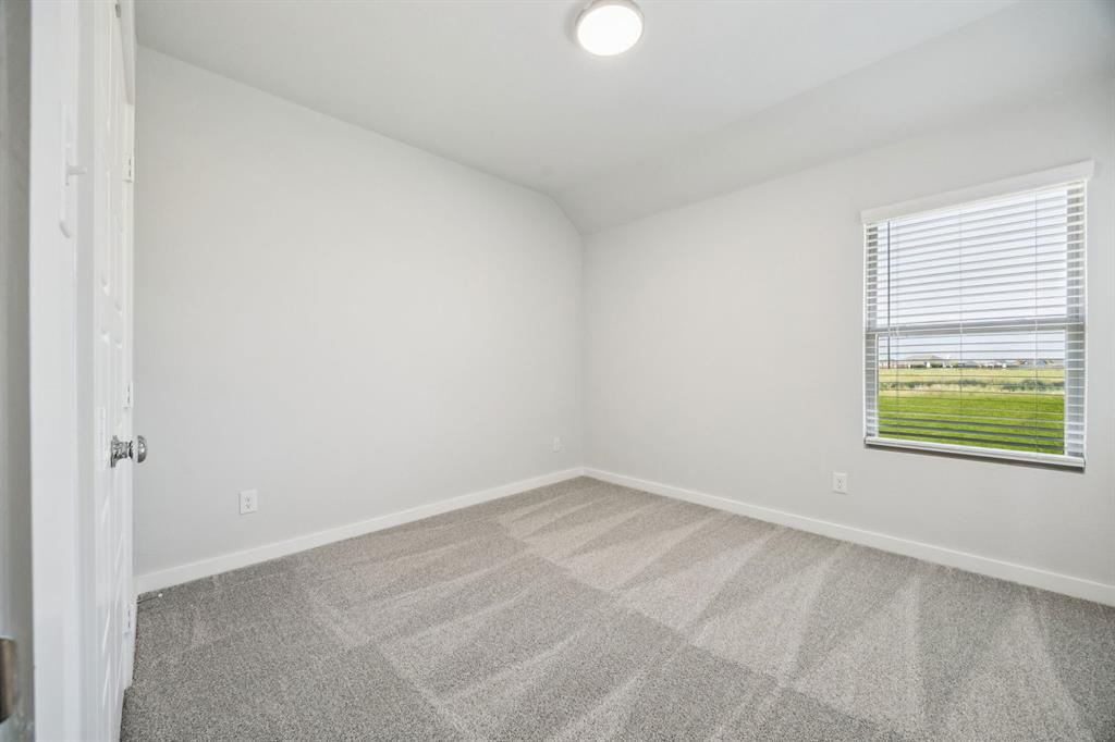 Bedroom in the Masters home plan by Trophy Signature Homes – REPRESENTATIVE PHOTO