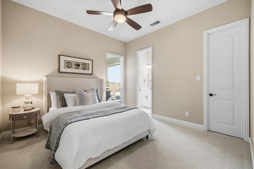 Plush carpeting, ceiling fan with light fixture, white interior door, window with horizontal blinds, and neutral wall paint