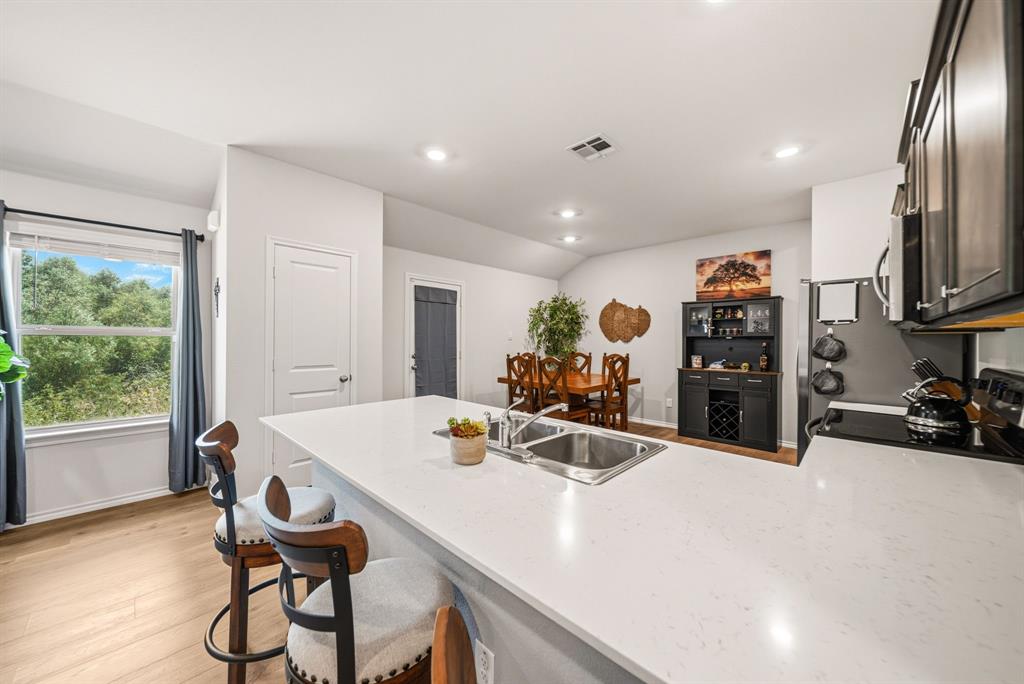 Kitchen island with an undermount double basin stainless steel sink