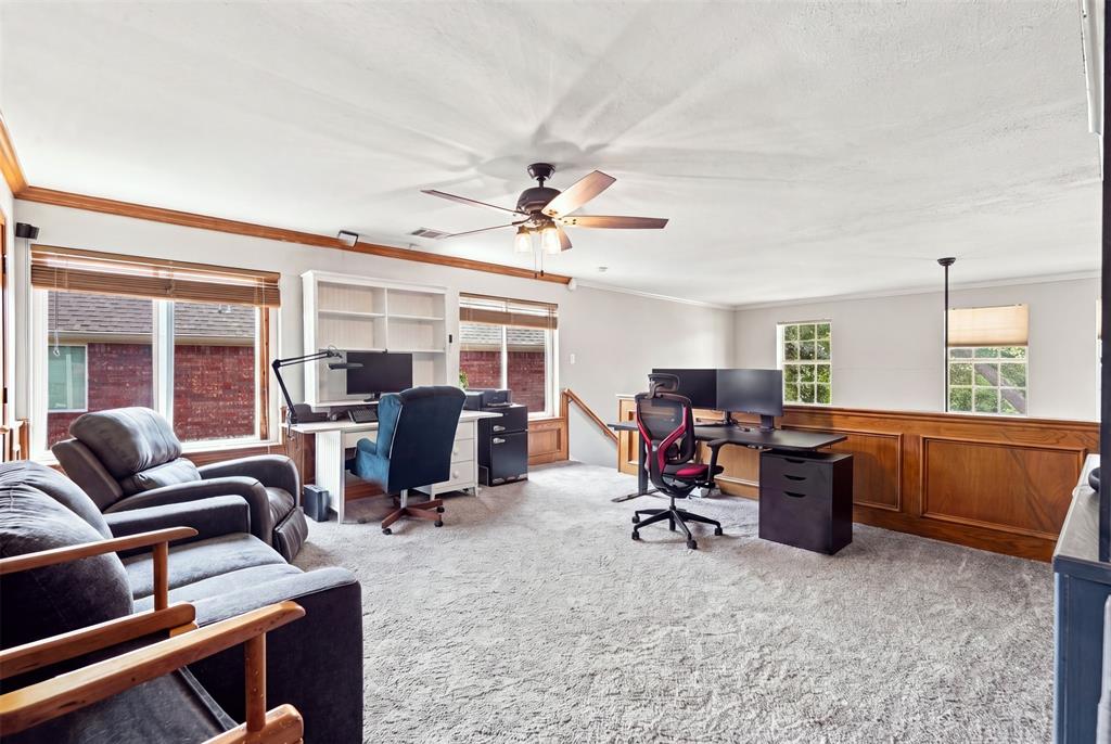 This lounge area has stairs to the primary bedroom, it can be used as an office