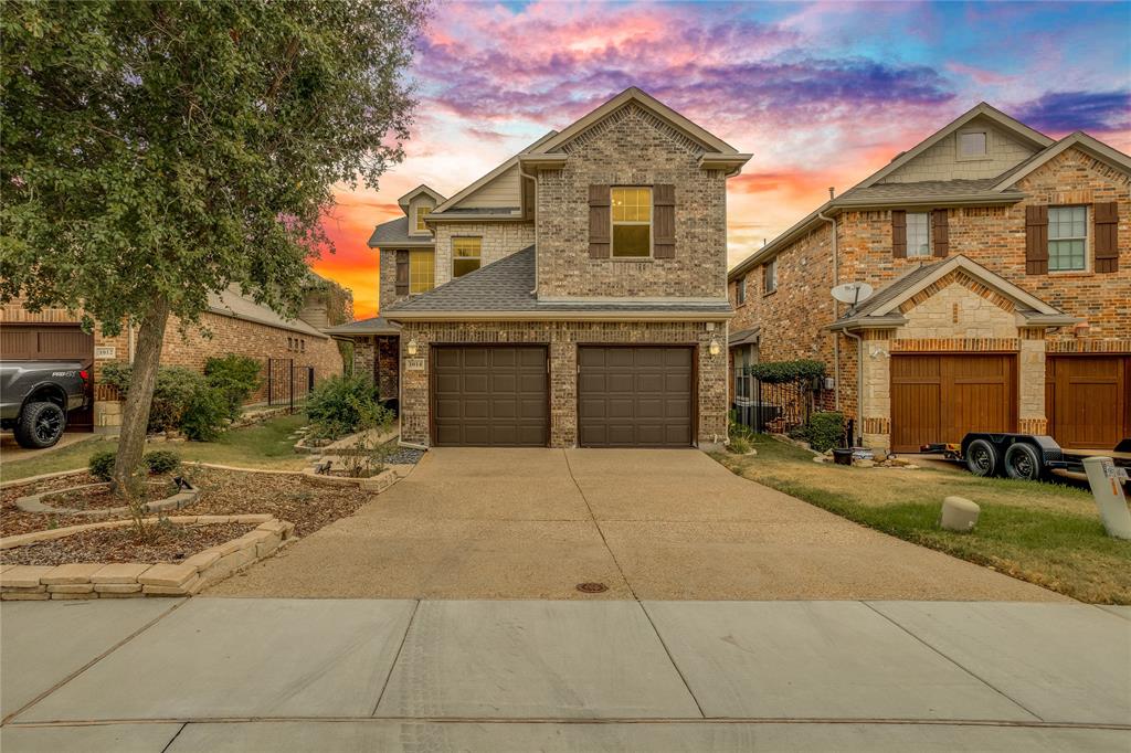 Brick and stone facade with a two-car garage