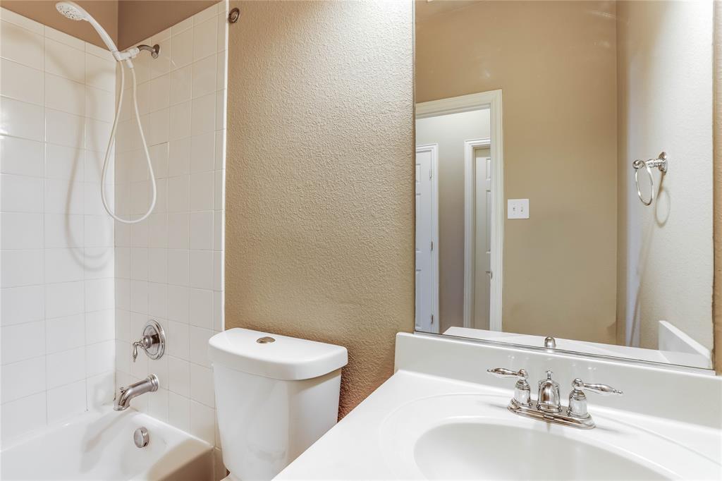 White vanity with an integrated sink and chrome faucet