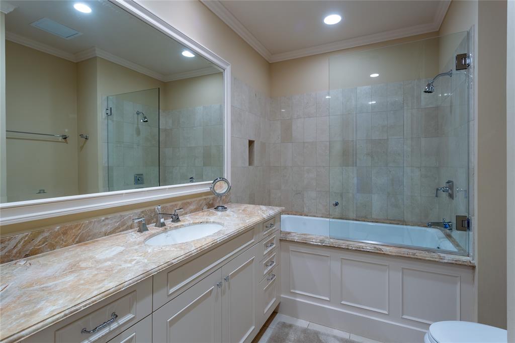 Ensuite Guest Bath has a large walk-in closet & linen closet.