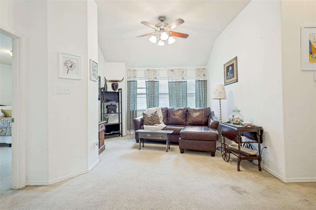 Separating the two bedrooms is a great secondary living room with vaulted ceilings. Makes a great office or play room.