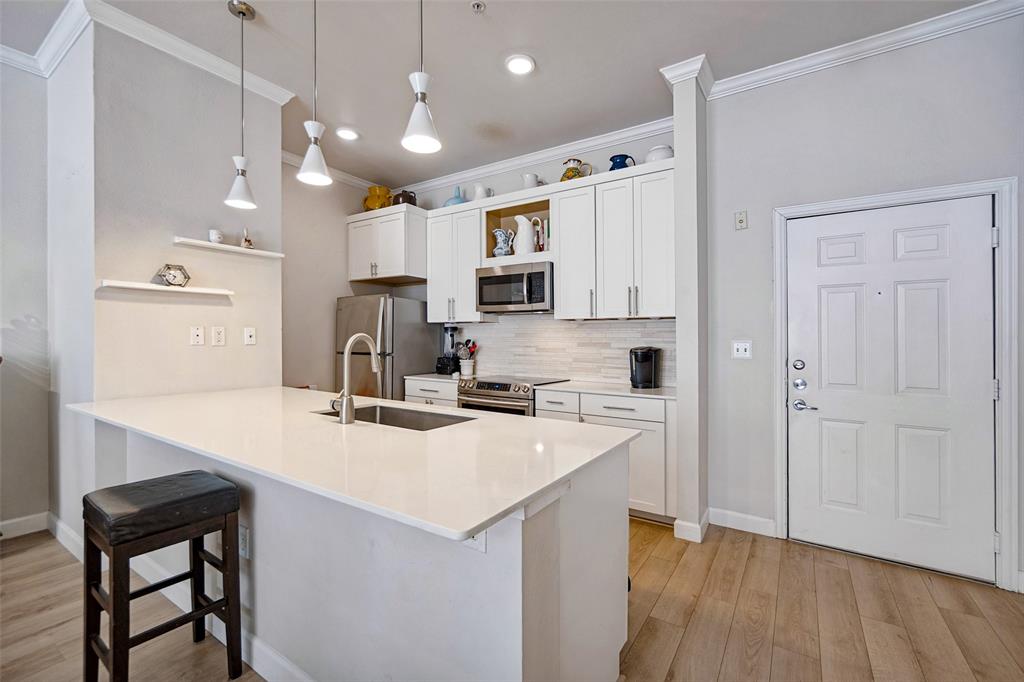 Updated kitchen with tons of storage & fridge to convey!