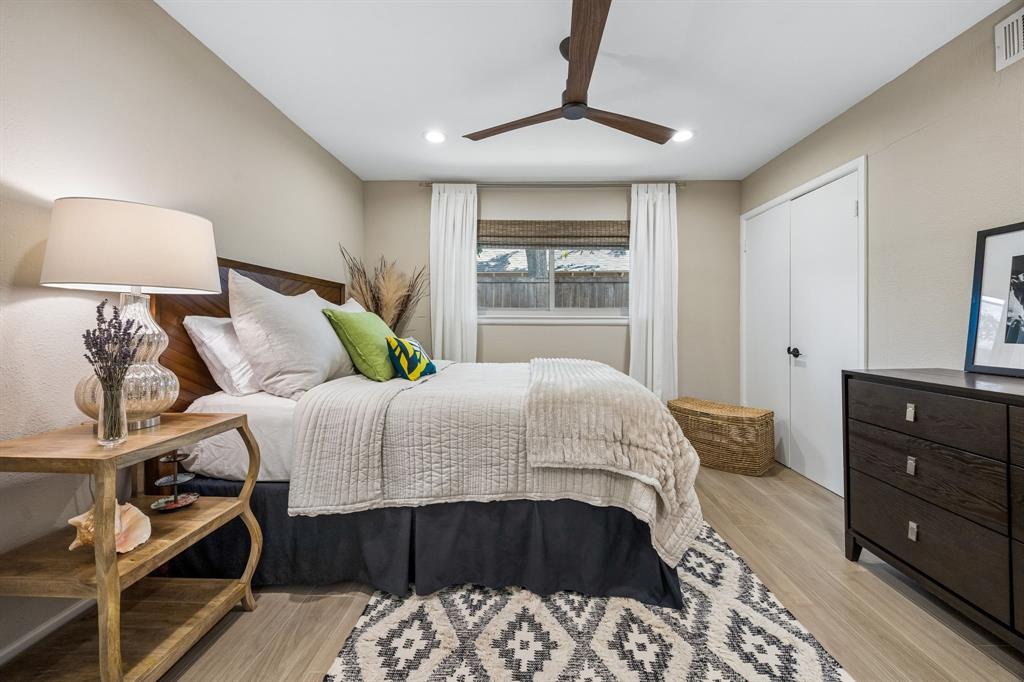 Wood-finish flooring, recessed lighting, and a dark wood ceiling fan