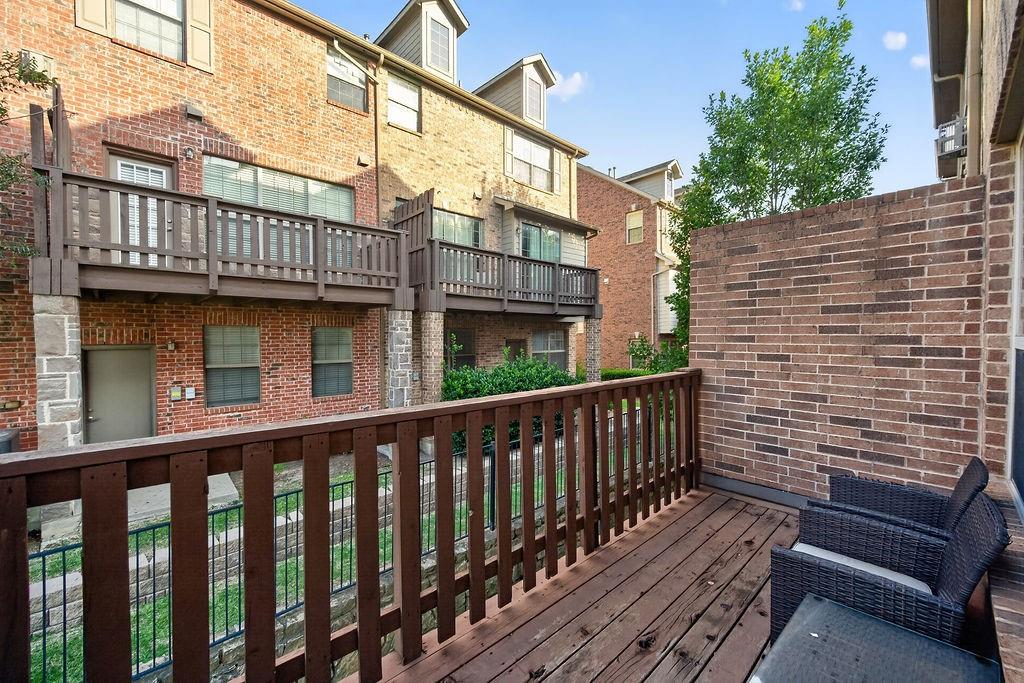Private wood-finish deck with brick privacy wall
