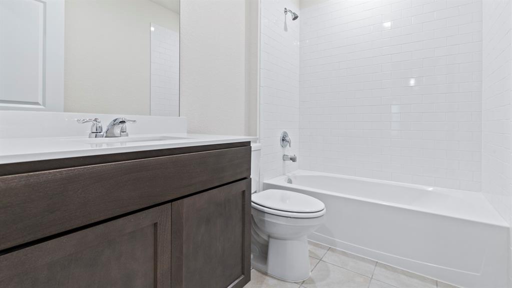 White ceramic subway tile surround with a built-in tub and shower White ceramic subway tile surround with a built-in tub and shower