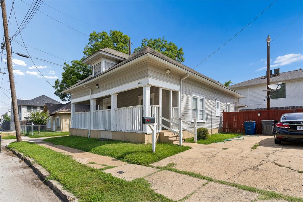 Siding exterior with dormer window and covered front porch
