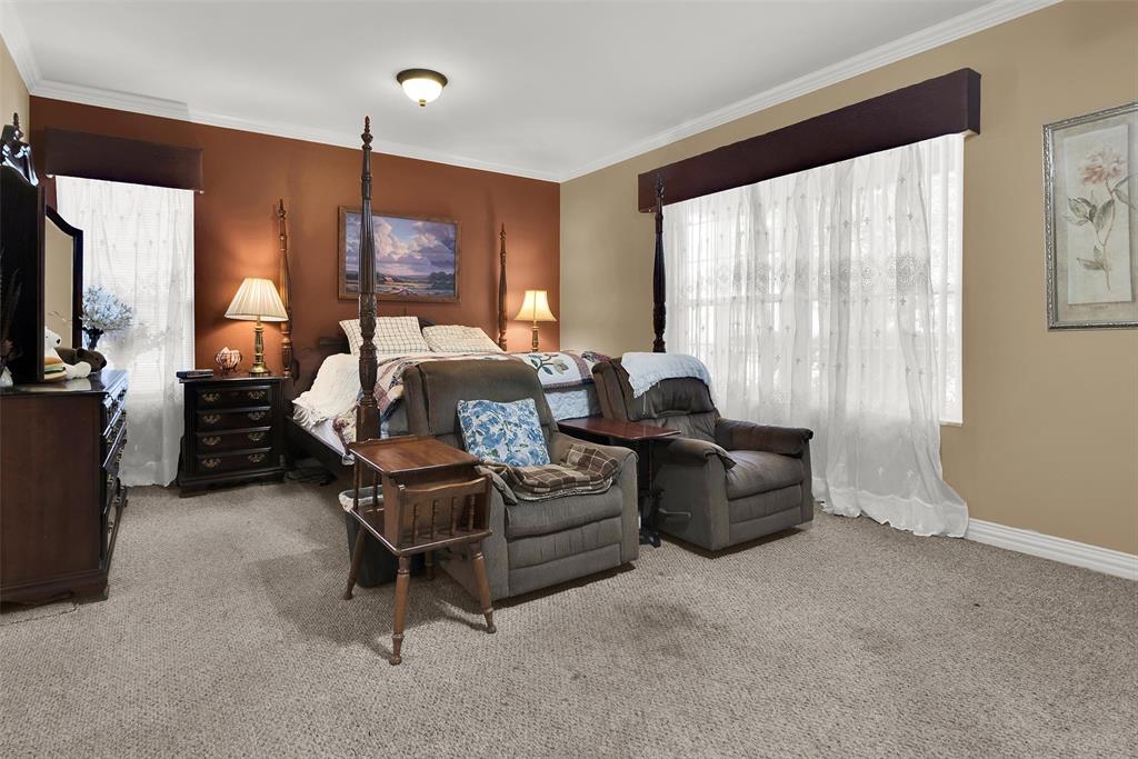 Carpeted flooring extending throughout the room