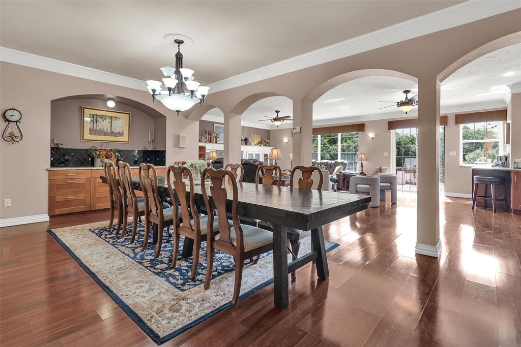 Expansive interior with wood-finish flooring and archway detailing Expansive interior with wood-finish flooring and archway detailing