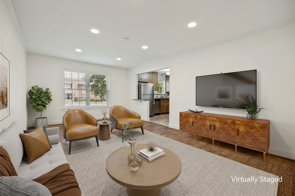 Recessed ceiling lighting, wood-finish flooring, white walls, and a window with natural light Recessed ceiling lighting, wood-finish flooring, white walls, and a window with natural light